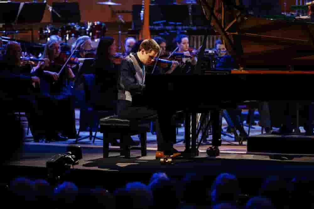 Ethan, BBC Young Musician 2022 - Final, playing piano, in front of orchestra