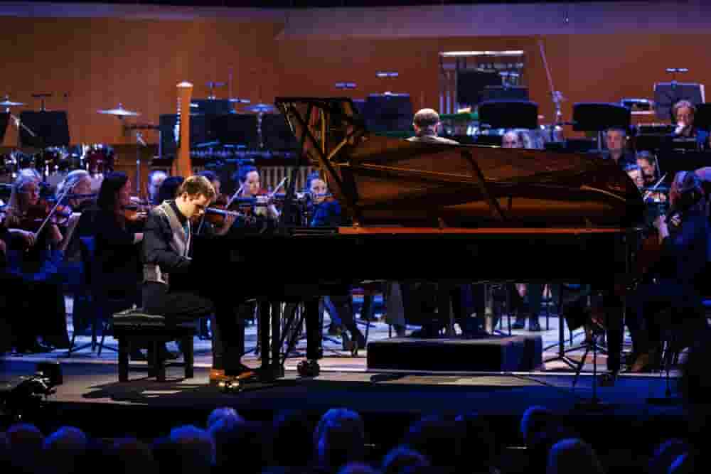 Ethan, BBC Young Musician 2022 - Final, playing piano, in front of orchestra